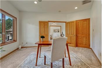 Double doors lead into the main level office with closet, recessed lighting, and in ceiling speakers.