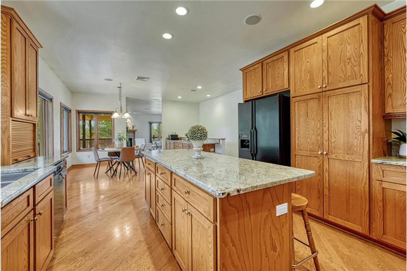 Beautiful wood cabinetry with granite countertops.
