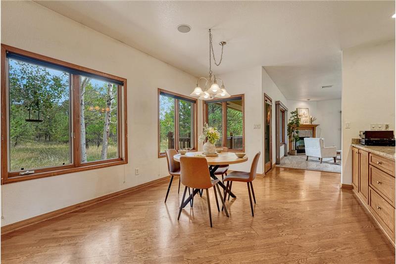 Bright breakfast nook looks out to the trees, so private!