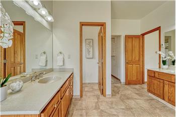 Two separate vanities in the primary bath.