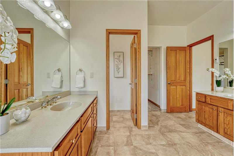 Two separate vanities in the primary bath.