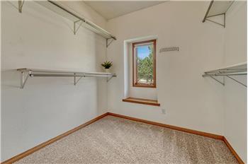 Primary walk-in closet.