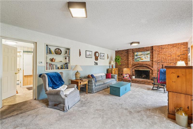 Note wood-burning fireplace in brick wall
