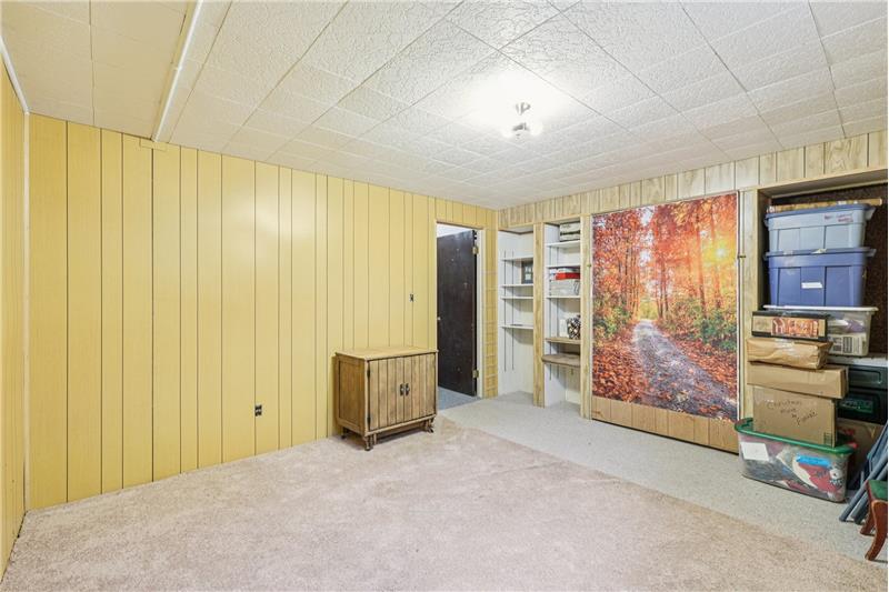 Non-conforming 5th bedroom in basement has Murphy bed.
