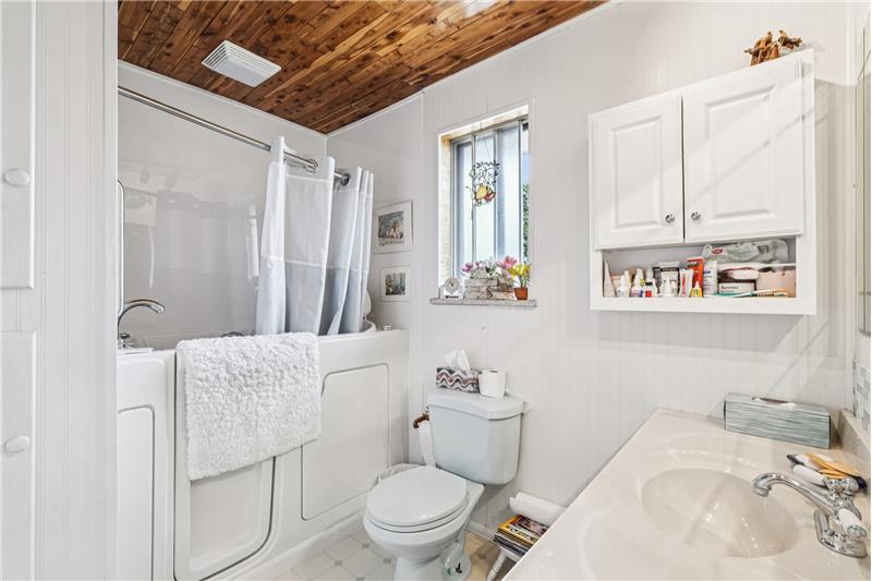 Primary bathroom has walk-in jetted tub/shower