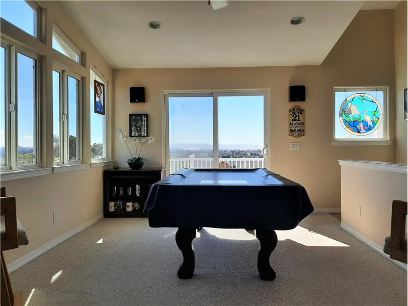 The upstairs Game Room touts it's own magnificent; the sun-filled room introduces the first of many ocean view!