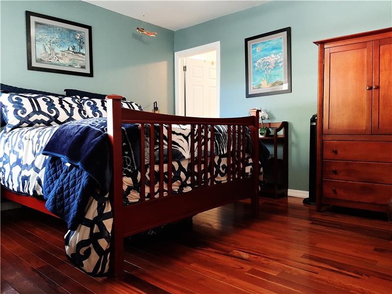 Bedroom 2 downstairs enjoys its own bathroom! And those floors! Wow!!