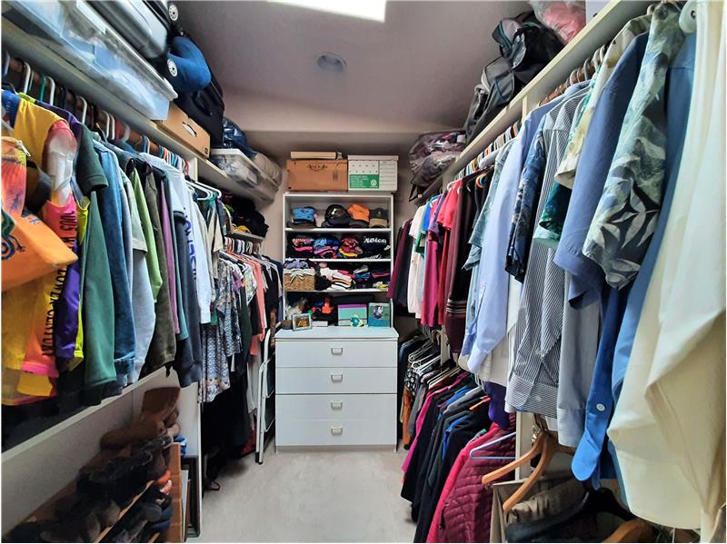 Walk-in closet supports Primary Bedroom, both lighted and skylit!