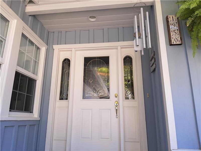 Classic coastal colors, this home's clean entrance is indicative of an impressive home to follow.