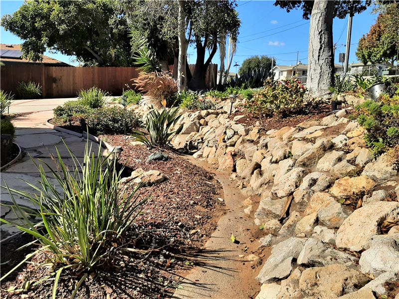 Professionally designed hardscaping is already in place with this hillside 7670 sq ft lot!