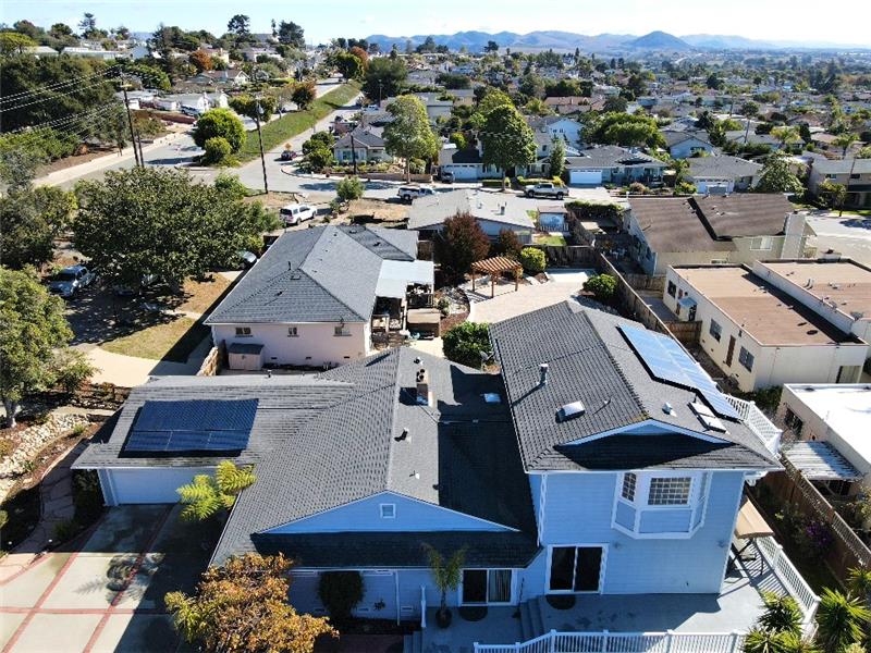 From this vantage, you can see this home's FULLY OWNED solar system with panels facing both South and West!