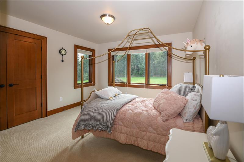 Second bedroom angle one. Big double wood door closets and multiple windows for excellent natural light.
