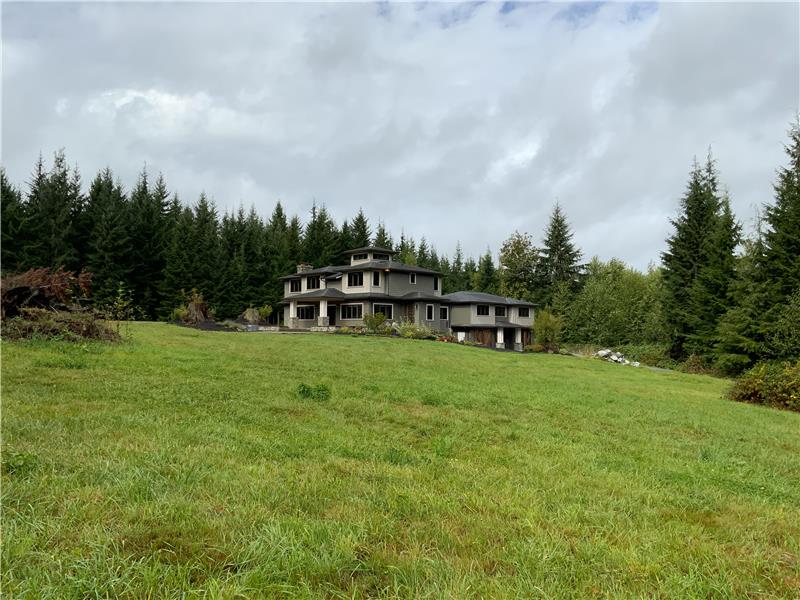 View of the home from the future potential horse pasture.