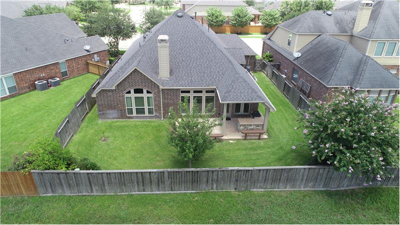 Aerial view of the house and backyard.