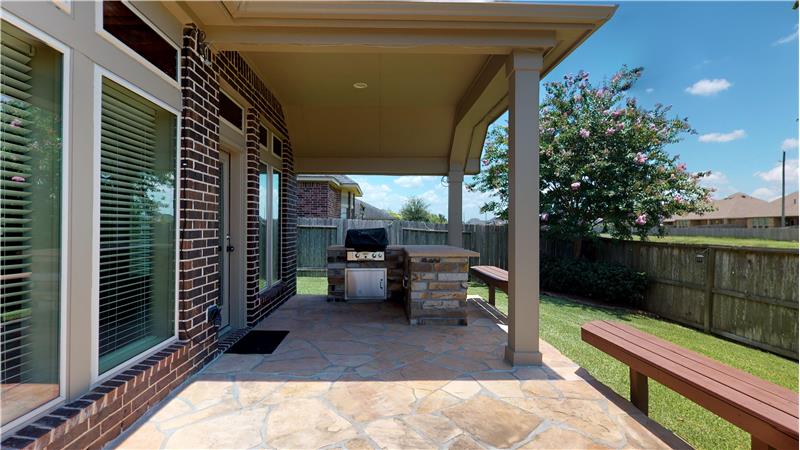 Covered Patio with summer kitchen.