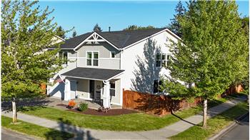 Looking NE toward the home. Notice the brand new 50-year, transferrable warranty, roof??