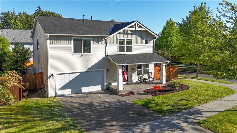 Looking SE toward the home. Garage is a three-car, one being tandem.