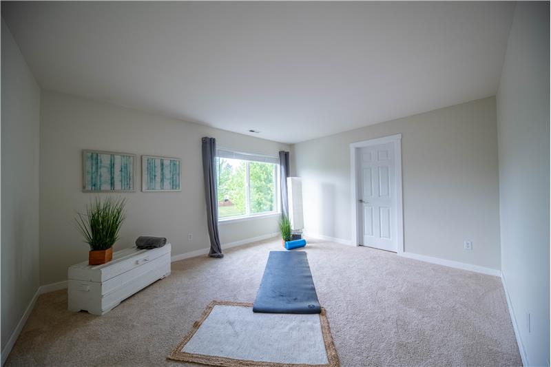Fourth bedroom with large walk-in closet.