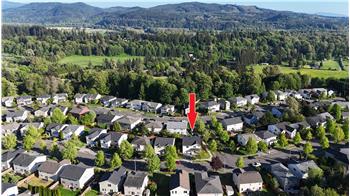 Aerial view of the house in the middle of the community (looking east).