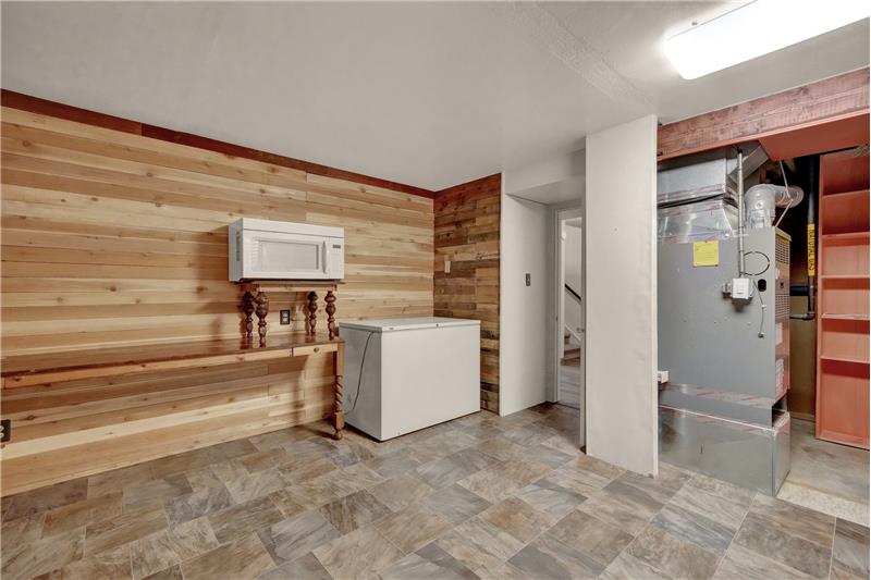 The Basement Laundry/Storage Room offers a freezer that stays