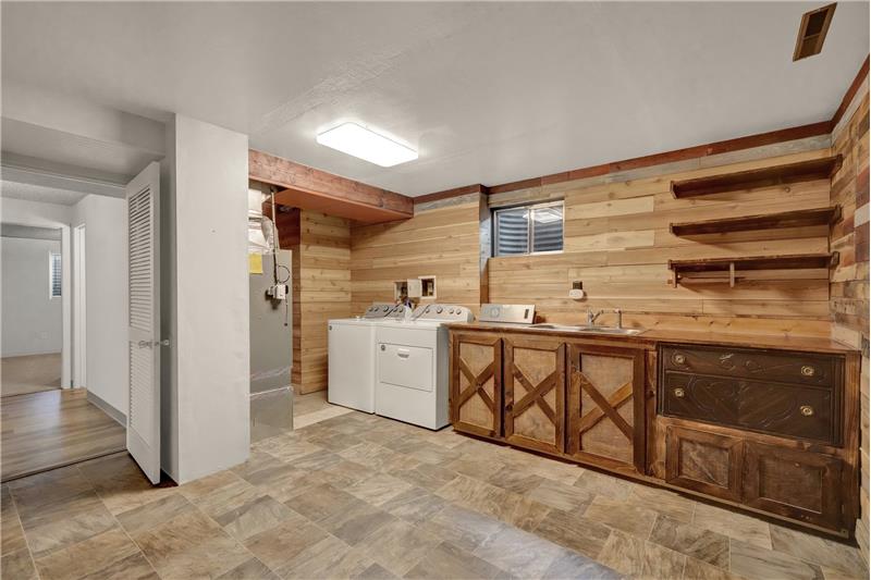 The Basement/Laundry Room includes the washer and dryer