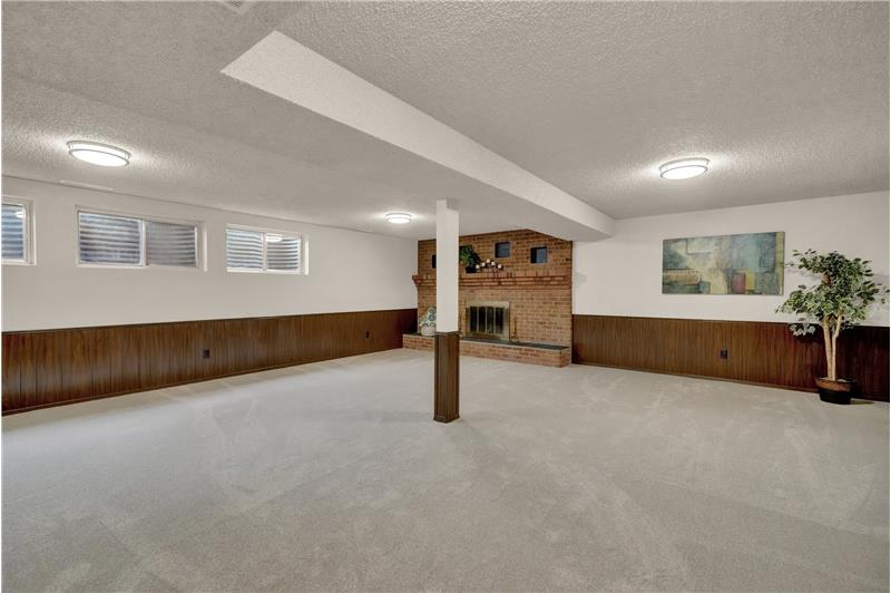 Basement Family Room with wood burning fireplace