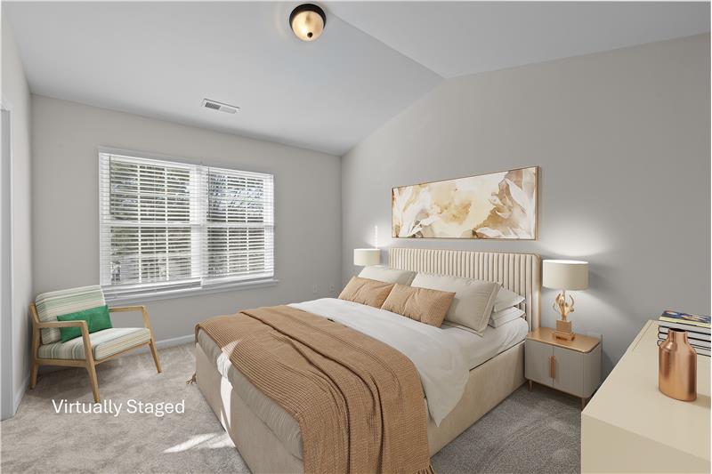 One of two self-contained bedroom suites on the upper floor with vaulted ceilings, brand new carpet, fresh paint, walk-in closet