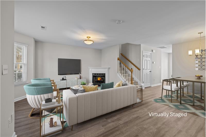 Gas log fireplace a focal point of the living room.