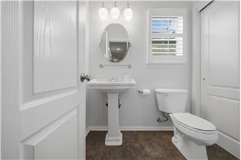 Downstairs half bath with large closet