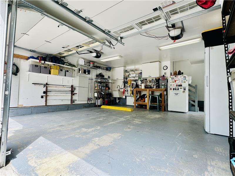 2 car garage with dual openers and utility sink