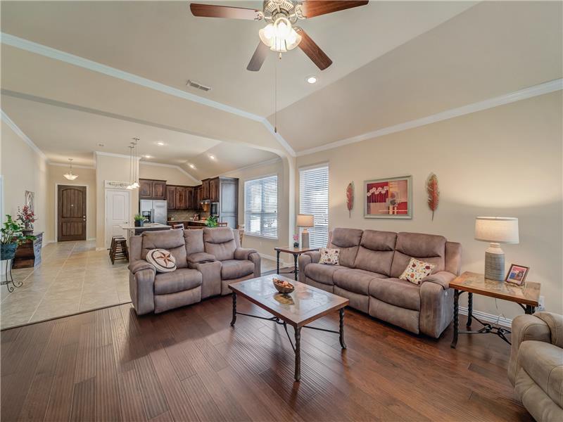 Open and spacious living space connects to kitchen