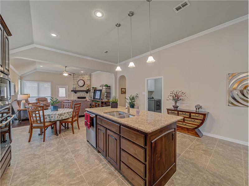 Kitchen Island, easy to care for tile flooring in the kitchen and entry way