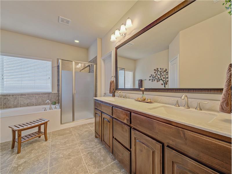 Luxurious primary bath with dual vanities