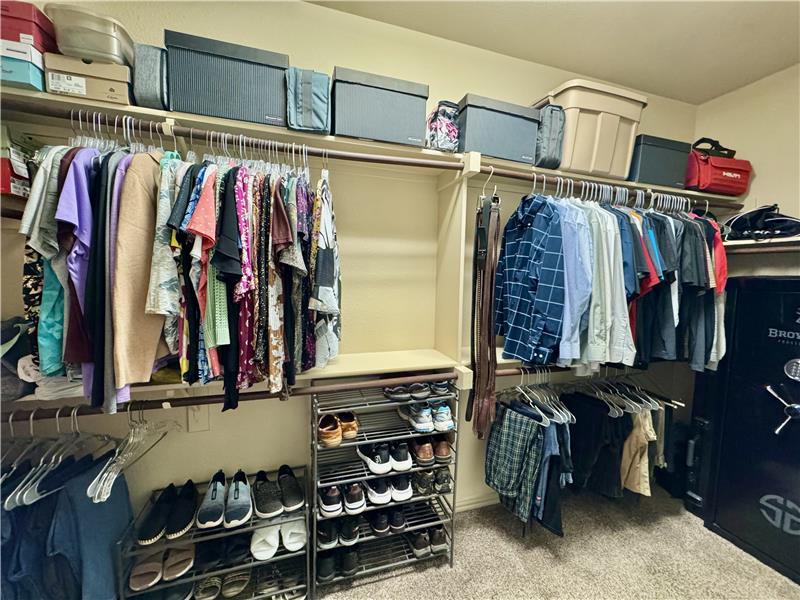 Very large primary bedroom walk-in closet