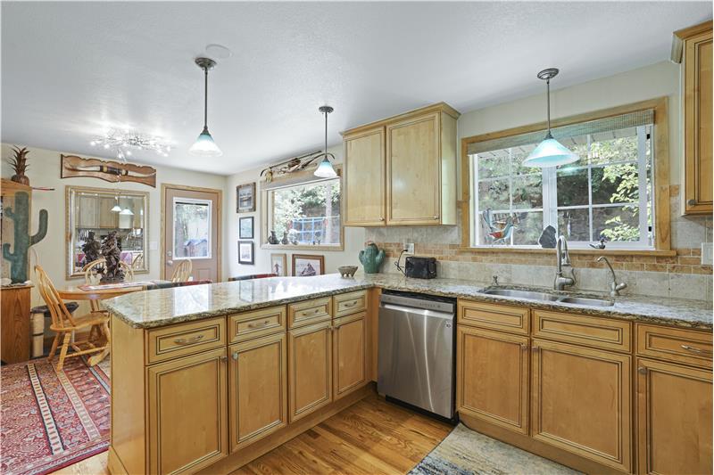 Slab granite countertops and stainless appliances