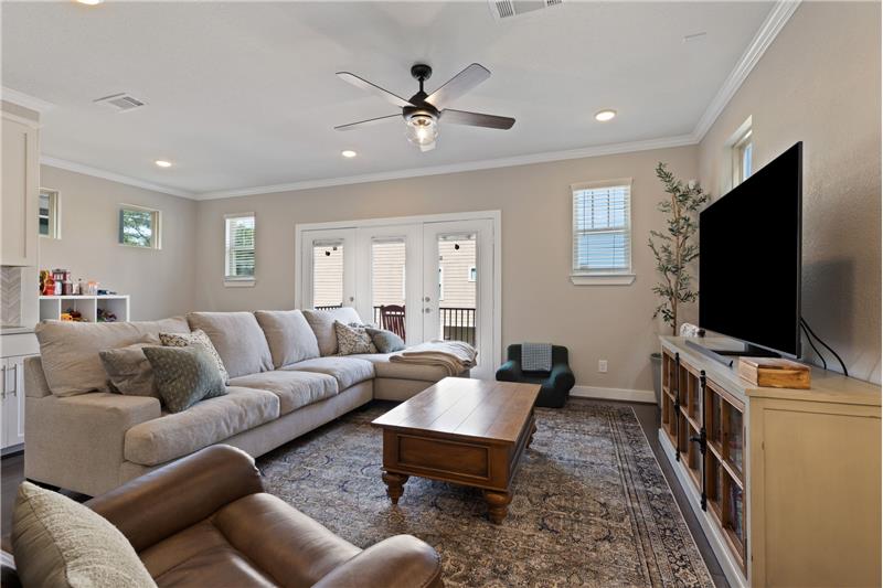 Living room has wet bar and extra sitting space.