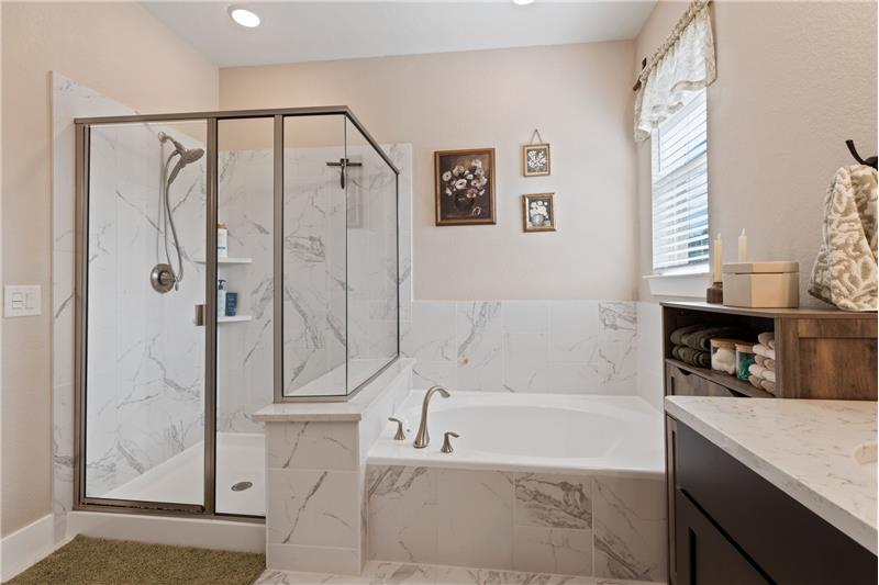 Primary bath with walk-in Shower and soaking tub.