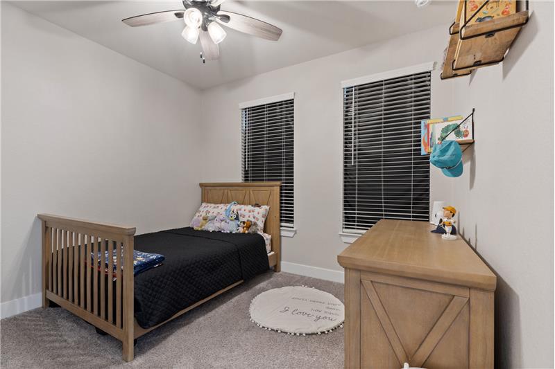 One of 2 secondary bedrooms upstairs.  Home as 4 bedrooms.