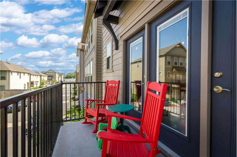 One of 3 outdoor living spaces.  Balcony off the living area