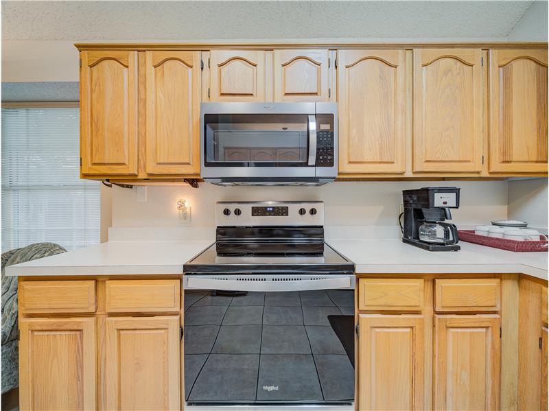 Kitchen featuring light brown cabinets and stainless steel appliances
