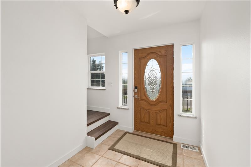 Bright tiled entryway and programmable deadbolt for convenient access