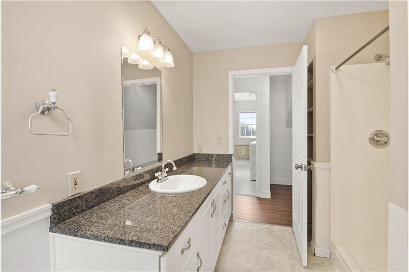 The master bath doubles as the main-floor bathroom, but plumbing in the laundry area provides an opportunity to add an additiona
