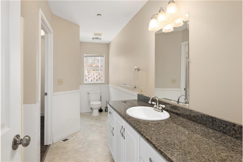 The Master Bath features a shower and a long counter with plenty of room to add an additional sink if desired.