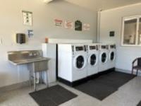 Laundry Room Features 4 Modern Washers plus Utility Sink, and 4 Modern Dryers.