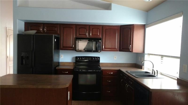 Kitchen with cherry cabs