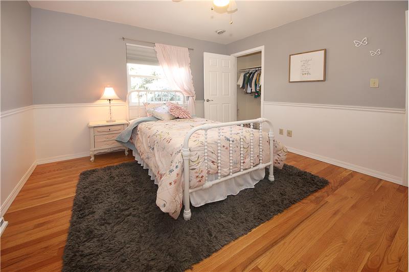 Bedroom 4 with hardwood floors and ceiling fan