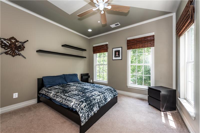 One of three secondary bedrooms on home's upper level.