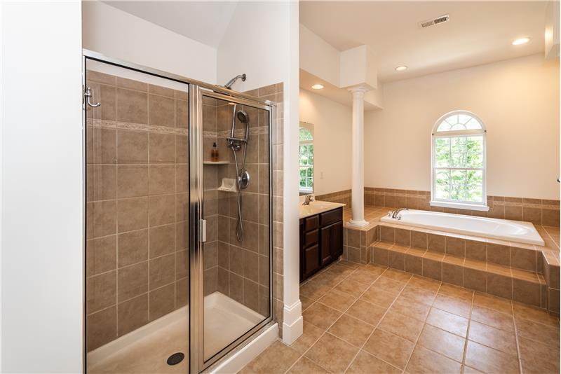 Step-in shower with tile surround.