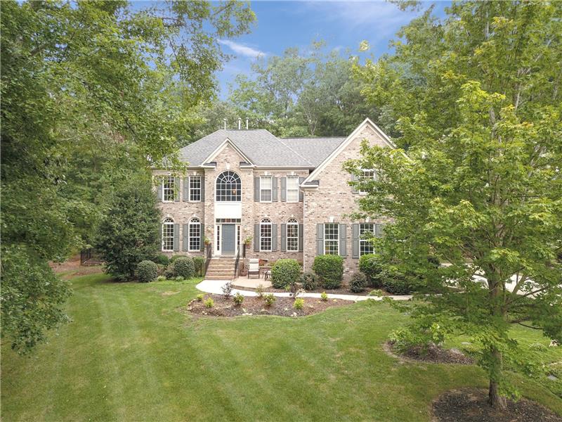 Gorgeous wooded setting offers privacy and natural beauty year-round.