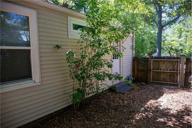 Side entrance with paver patio